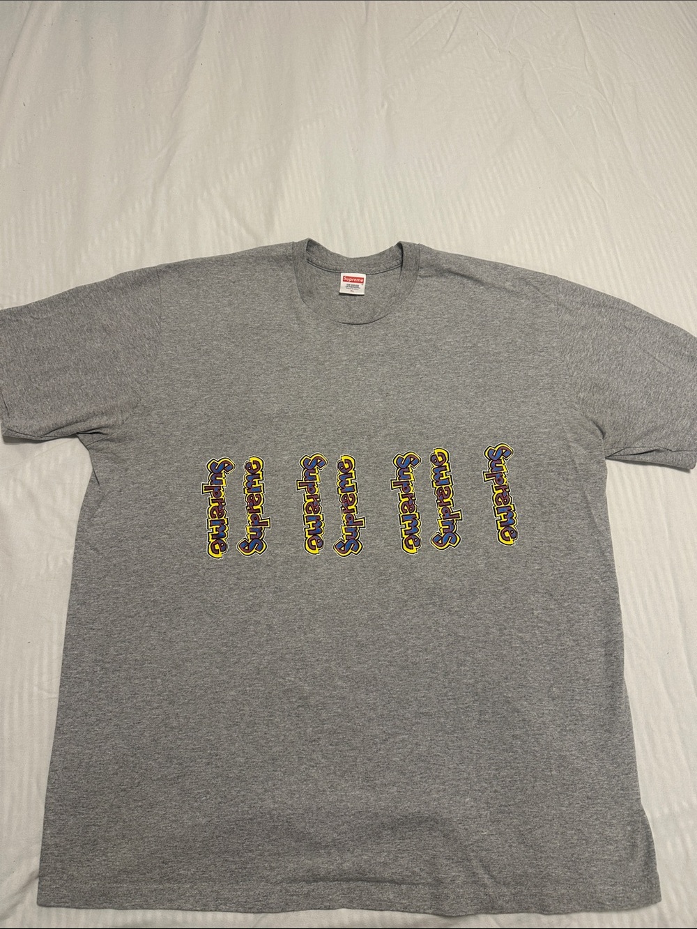 Supreme Grey Tee with Yellow & Purple Repeated Logo